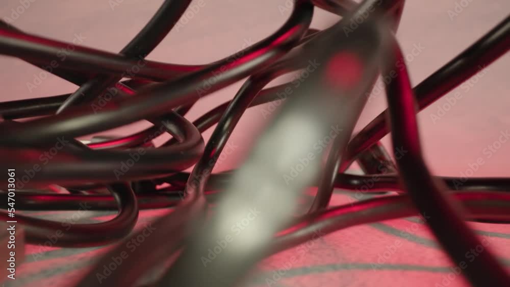 Tangled USB cables of black color lying at monochrome background at professional red artificial light of studio room pull out macro Tangled USB cables of black color lying at monochrome background at professional red artificial light of studio room pull out macro