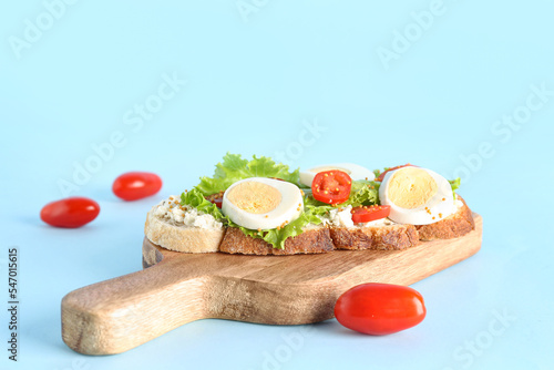 Wooden board of tasty toast...