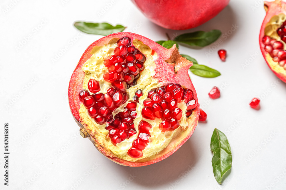 Half of fresh pomegranate on white background Half of fresh pomegranate on white background