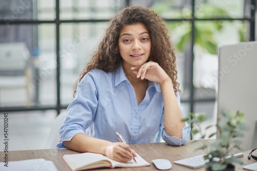 Business woman working at office with documents on his desk