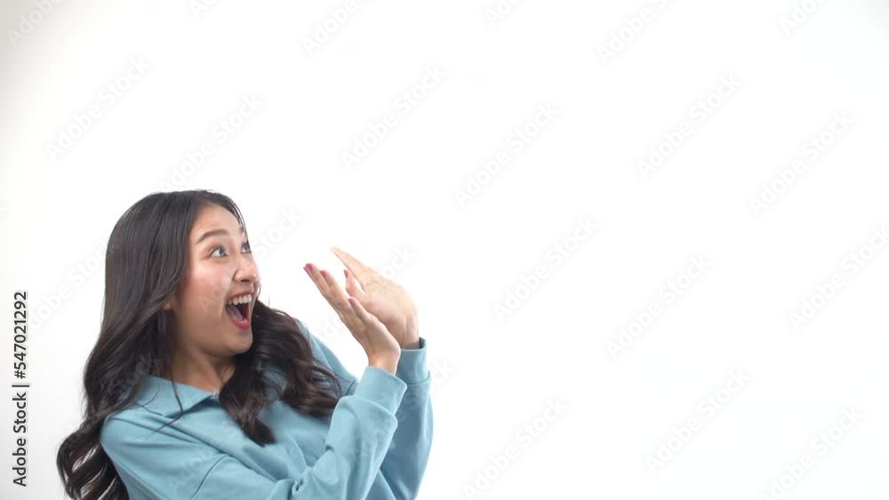 Excited asian woman raised hands on copy space white background. Surprise Thai model girl shock wow promotion smile raised hands empty funny smile dancing over isolated. Lifestyle shopping concept. Excited asian woman raised hands on copy space white background. Surprise Thai model girl shock wow promotion smile raised hands empty funny smile dancing over isolated. Lifestyle shopping concept.