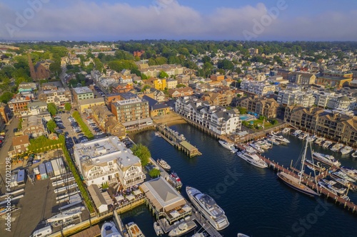 Aerial shot of the Newport Harbor in Rhode Island with ducked boats and a landscape photo