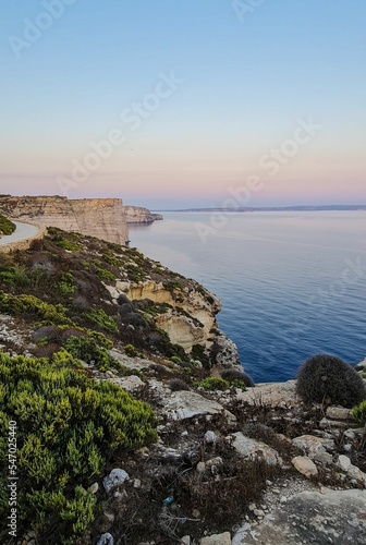 Beautiful view of the Sanap Cliffs in Munxar, Malta during sunset photo