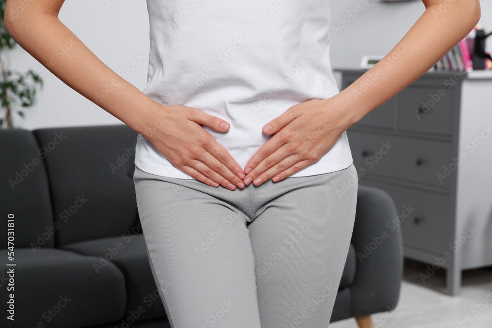 Woman suffering from cystitis at home, closeup Woman suffering from cystitis at home, closeup