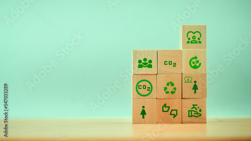 Carbon concept, direction of low emissions or less carbon in order not to harm the population and children. wooden cube with CO2 Green CO2 emission concept on a wooden block in the green industry busi