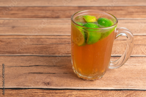 homemade hot tea with slice fresh lime on top. herbal drink for refreshing
