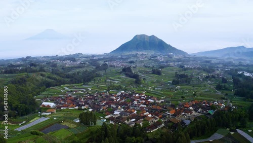 Village with misty Andong and Telomoyo mountain photo