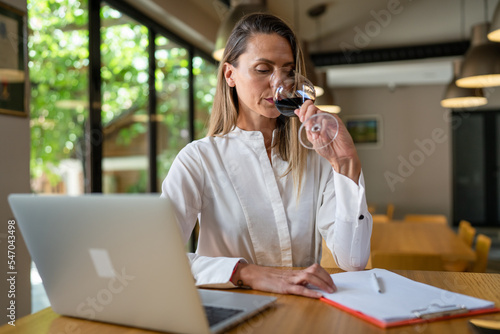 woman female enologist wine quality check at winery