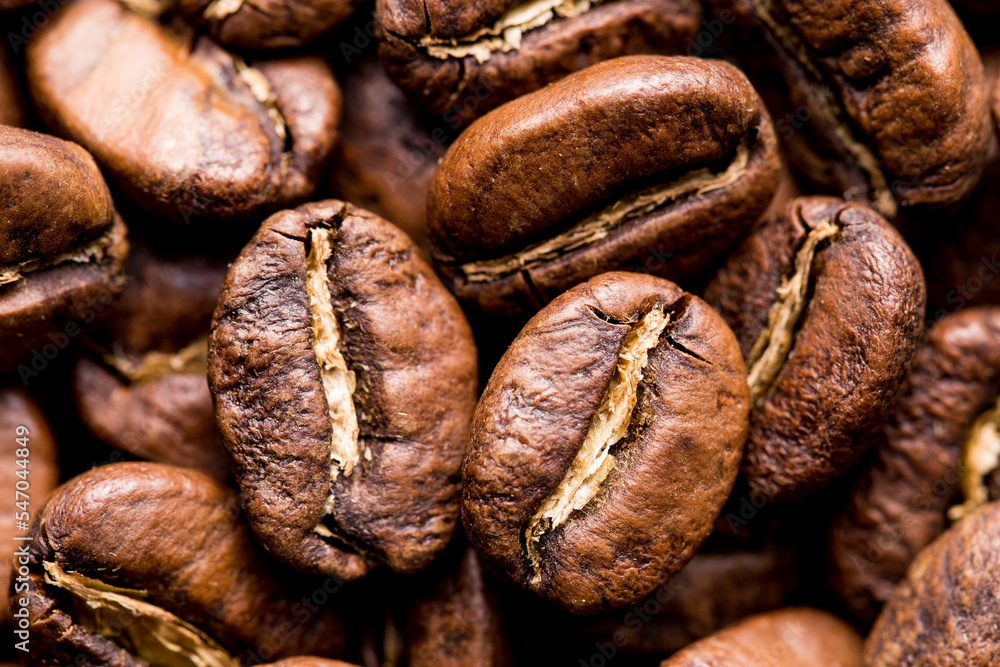 Roasted coffee beans top view, closeup image, space for text Roasted coffee beans top view, closeup image, space for text