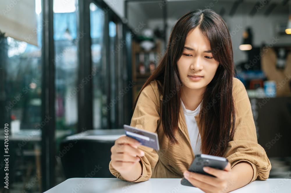Young businesswoman paying order having contactless payment with cardit card Young businesswoman paying order having contactless payment with cardit card