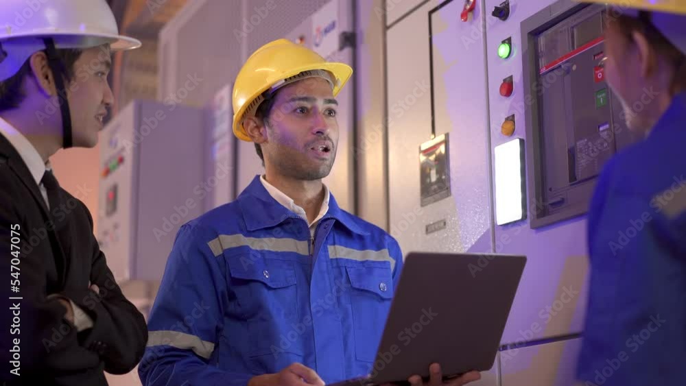 Team of engineer inspecting electric control panel. Team of engineer inspecting electric control panel.
