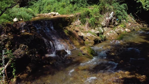 Areal drone footage from Karpenisi area, into the mountains and lake.