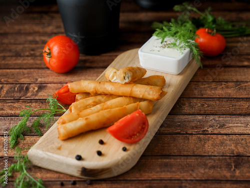 Sigara Boregi - Turkish Cigar Shaped Rolls, Turkish Borek, Round Borek, Tray pastry (Turkish name; sigara borek)  photo