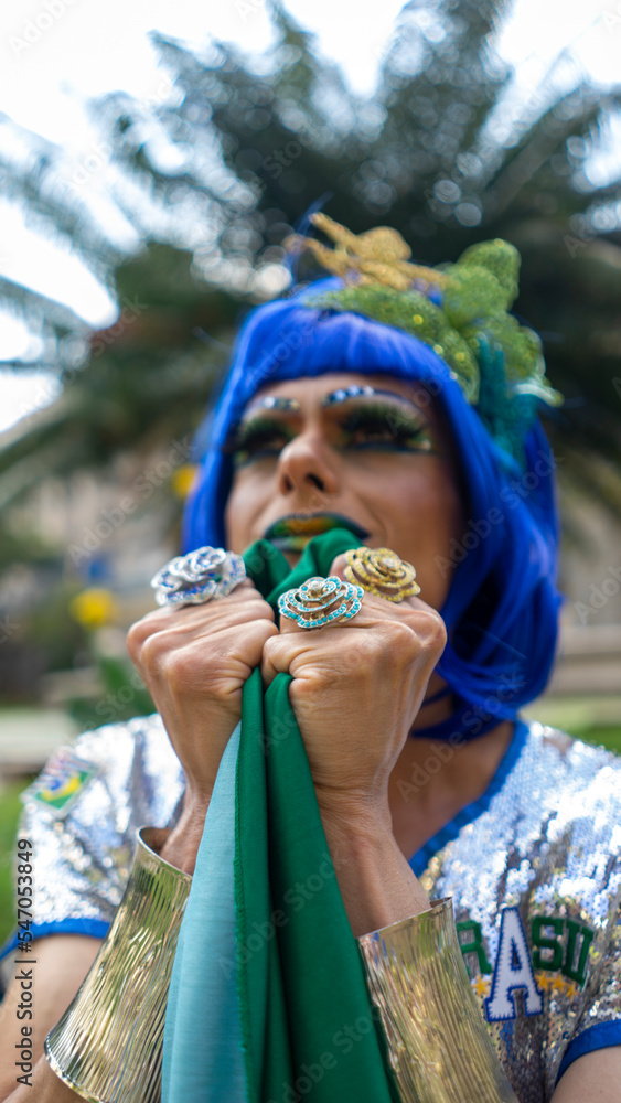 Dragqueen in her green and yellow outfit and makeup cheering during the world cup Dragqueen in her green and yellow outfit and makeup cheering during the world cup