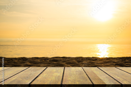 Empty Wooden Table on blur Sea with Sunset Background Blank Counter on Water Ocean with sunrise at Coast Mock Up Shore Seaside Island Nature Landscape Backdrop Broken Heart or Tropical Summer Holidays