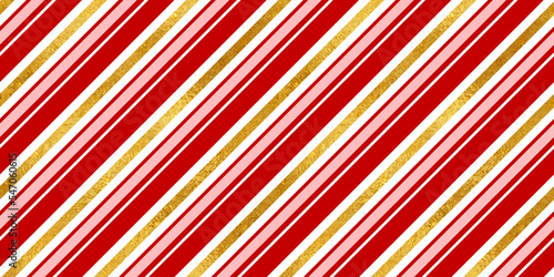 Christmas seamless pattern of red and white diagonal candy cane stripes or lines with shiny gold leaf foil background. Beautiful xmas or winter holiday wrapping paper, craft texture or backdrop.
