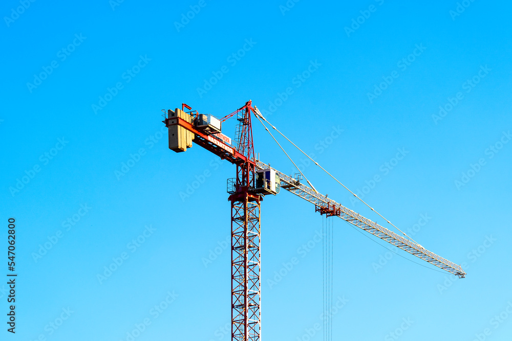 ,tower crane against the sky and Ostankino TV tower ,tower crane against the sky and Ostankino TV tower