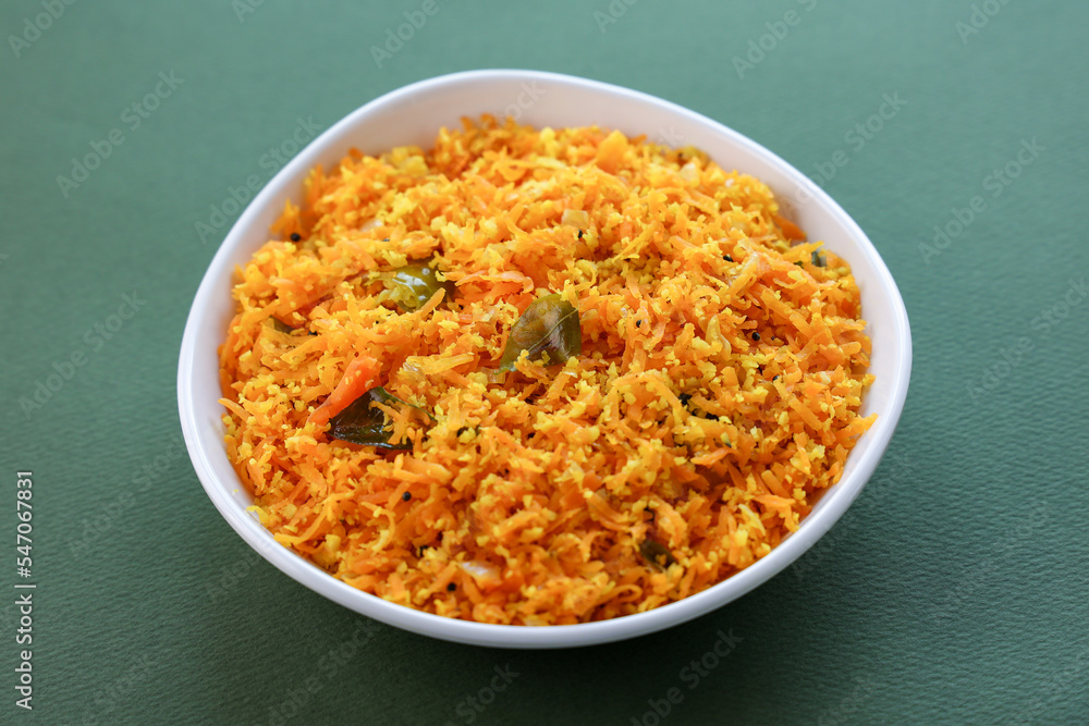Carrot thoran , stir fried carrots with herbs and spices. healthy vegetarian diet meal. vegan appetizers background in Kerala India. Carrot thoran , stir fried carrots with herbs and spices. healthy vegetarian diet meal. vegan appetizers background in Kerala India.