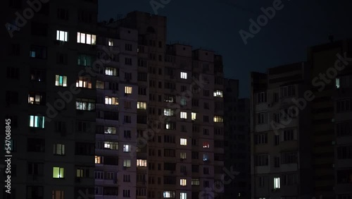 Kyiv, Ukraine. November 2022. blackout. ambulance light on dark houses.