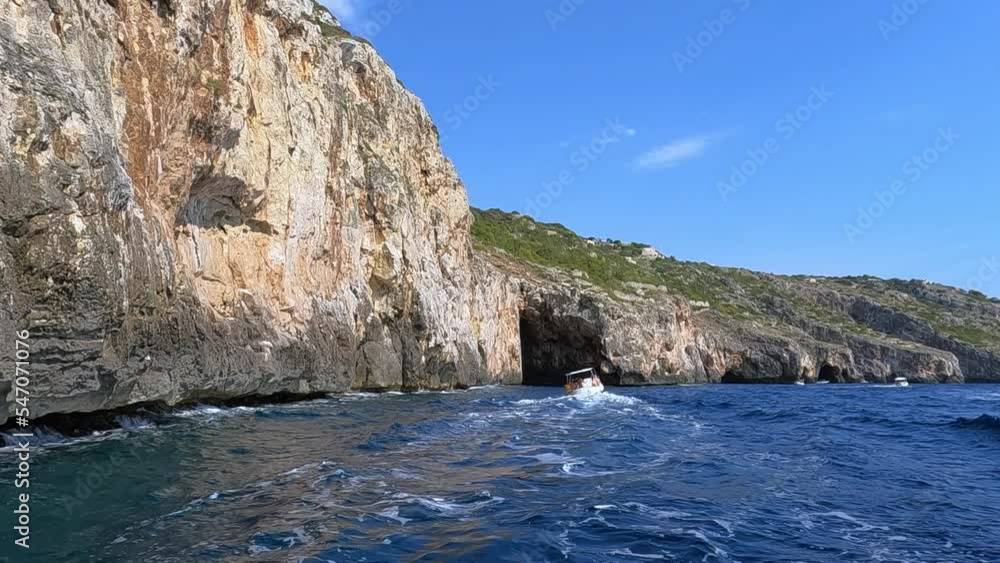 Tour boat at Punta Meliso where Ionian and Adriatic seas meet. Apulia region in Italy, slow motion at 50fps Tour boat at Punta Meliso where Ionian and Adriatic seas meet. Apulia region in Italy, slow motion at 50fps
