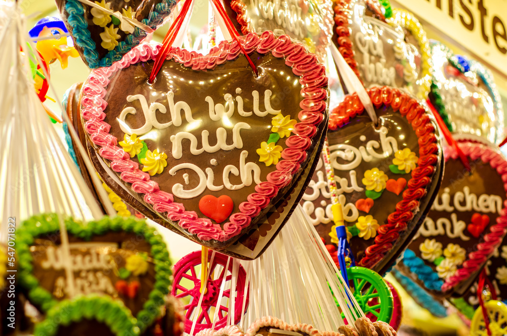 Fototapeta premium Gingerbread Hearts at German Christmas Market. I just want you - inscription in German