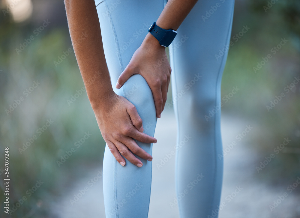 Knee pain, injury and sports accident of a woman hiking, running or doing exercise in nature. Medical emergency, muscle sprain and injured leg of an athlete outdoor trekking for a workout or training Knee pain, injury and sports accident of a woman hiking, running or doing exercise in nature. Medical emergency, muscle sprain and injured leg of an athlete outdoor trekking for a workout or training
