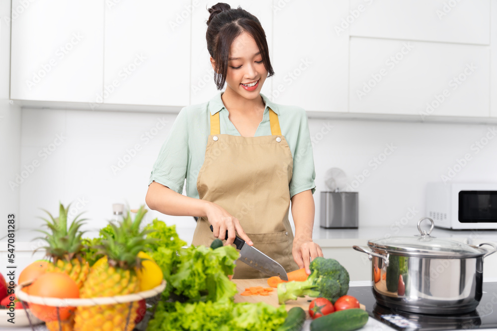 Portrait of a housewife in the kitchen at home