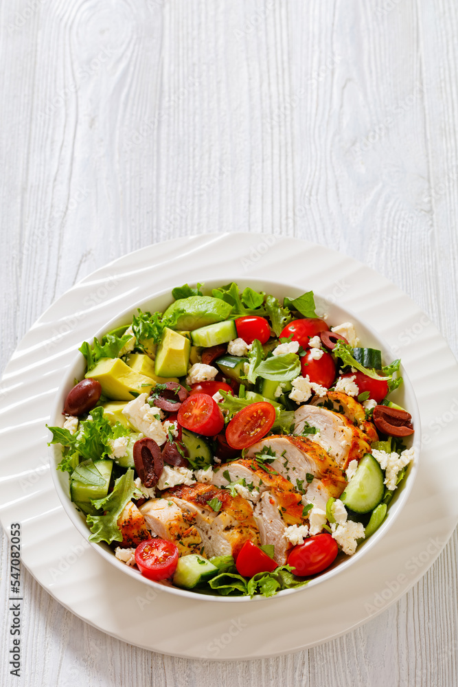 Mediterranean grilled Chicken Salad in white bowl Mediterranean grilled Chicken Salad in white bowl