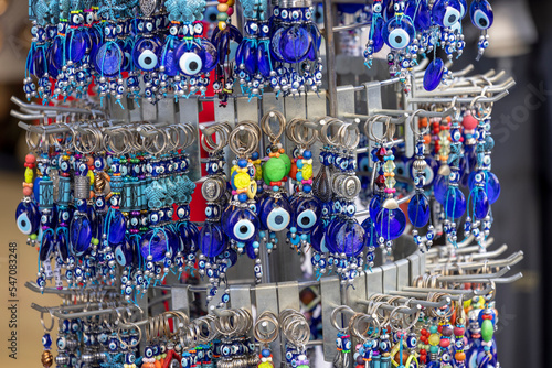 Typical souvenir shop on a street in district of Plaka, key rings with eye of prophet pattern, Athens, Greece