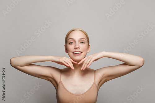 Natural beauty portrait of female face and body with perfect fresh skin on white background