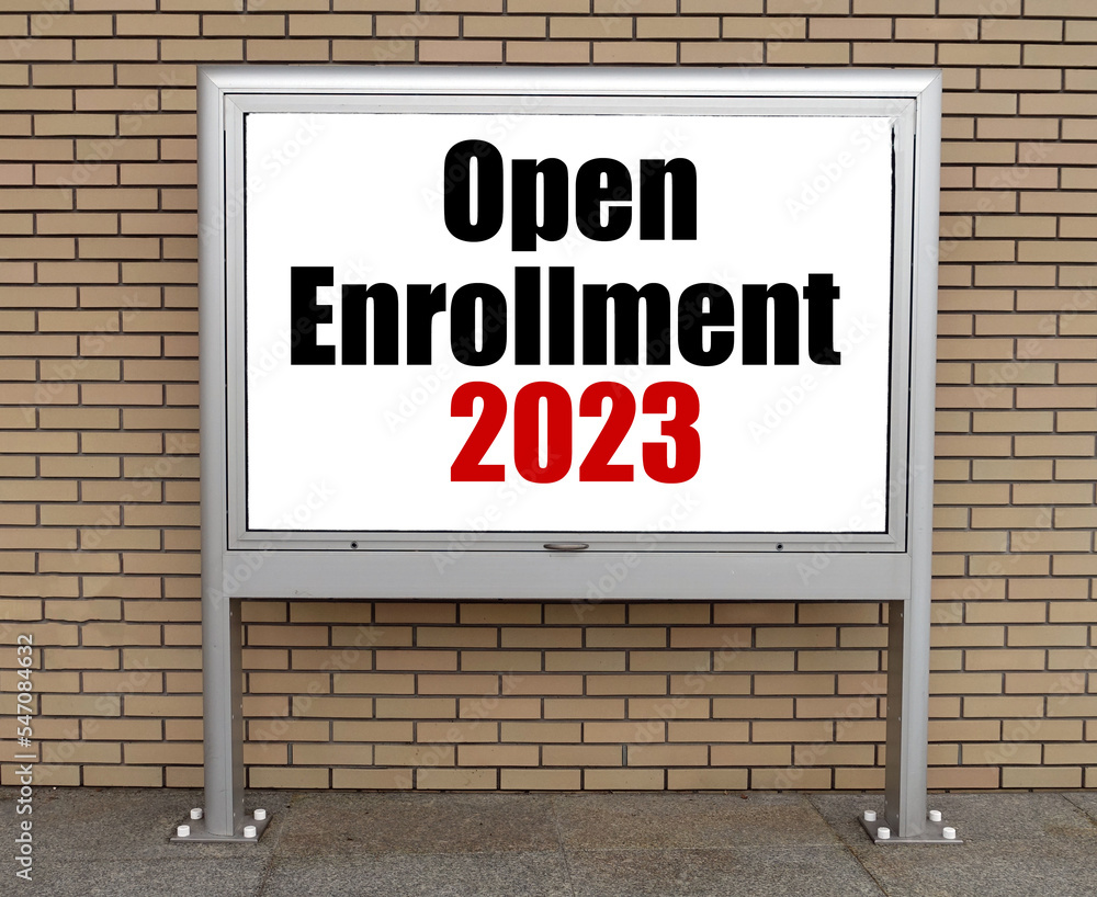 Fototapeta premium Open Enrollment 2023 words on bulletin board.