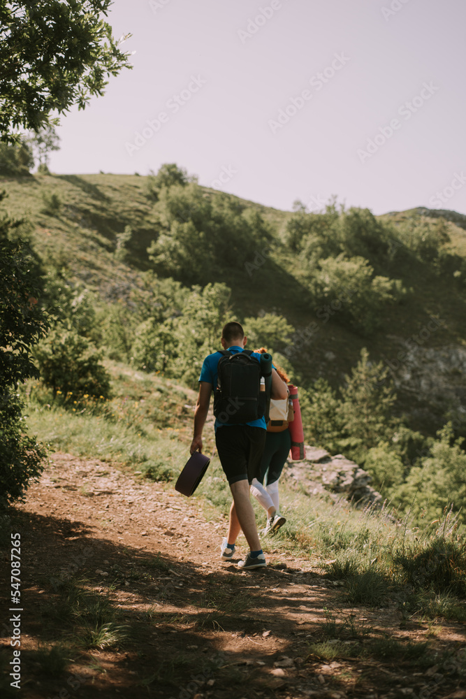 Yoga partners hiking