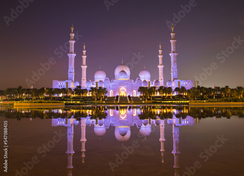 Tourists visit the Sheikh Zayed Grand Mosque. Night time view opposite the grand mosque. 