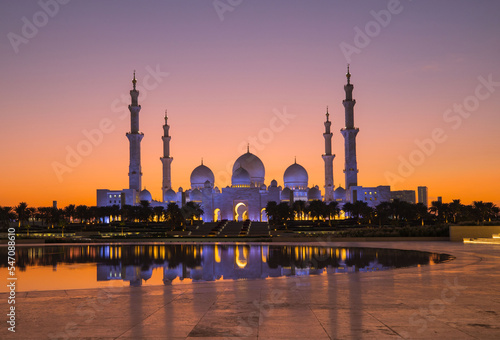 Tourists visit the Sheikh Zayed Grand Mosque. Night time view opposite the grand mosque. 