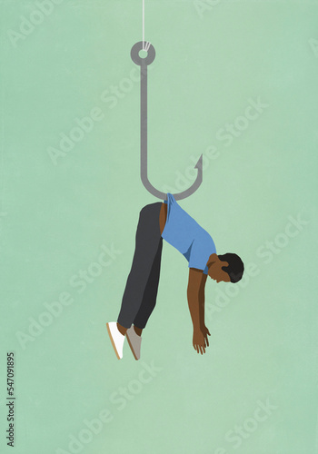 Man dangling from fishing hook
 photo