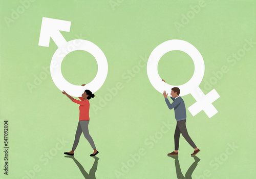 Couple carrying opposite gender symbols on green background
 photo