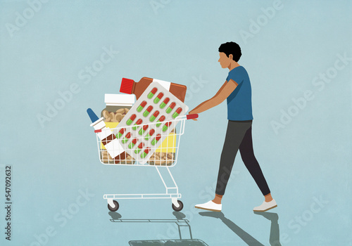 Man pushing shopping cart with medication
 photo