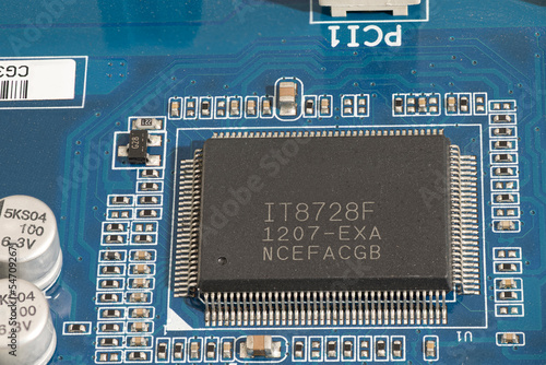 Computer chip on the blue motherboard. Copy space on chip.
Power of technology,  Motherboard circuitry, Computer chip.Electronic microcircuit. Microchip, photo
Motherboard circuitry. 