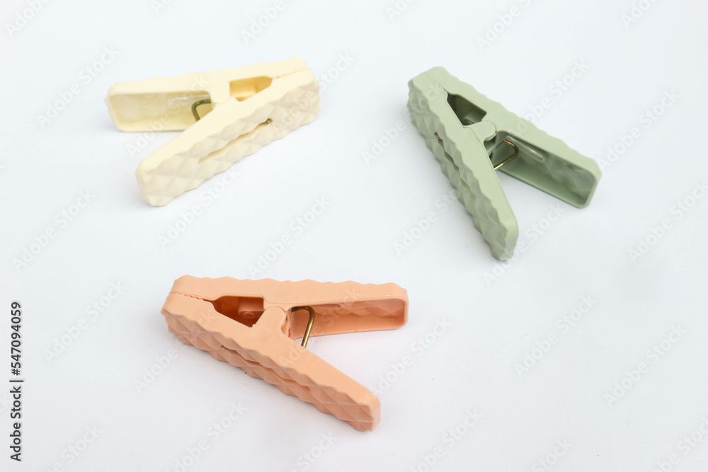 A clothespin or clothes pegs isolated on white background. A clothespin or clothes pegs isolated on white background.