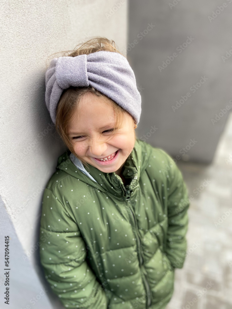 Portrait of modern happy girl in gray headbands and stylish autumnal outfit Portrait of modern happy girl in gray headbands and stylish autumnal outfit