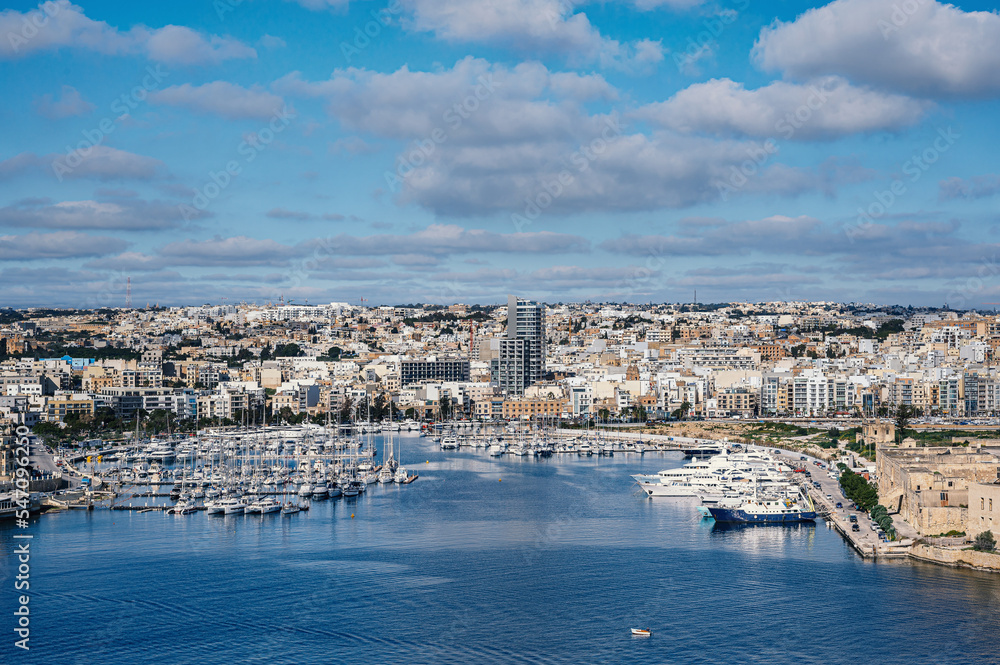Sliema harbor with modern buildings and sail boats in Malta