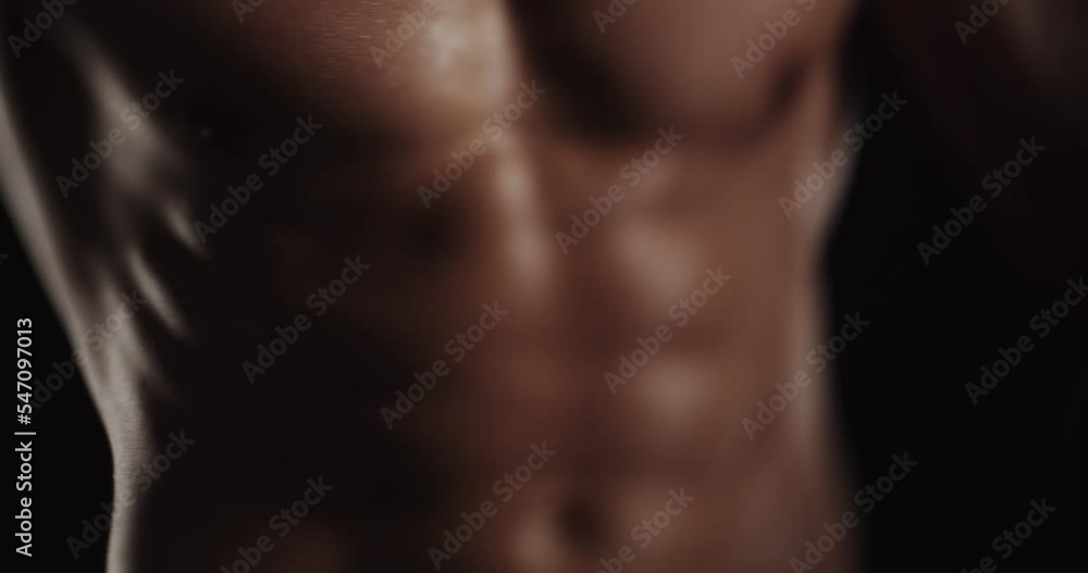 Flexing while showing his body, tilt shift