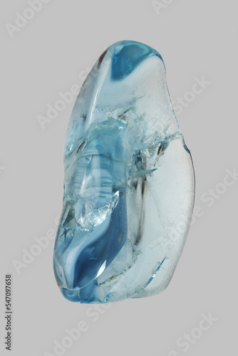 Still life close up blue aquamarine stone on gray background
 photo