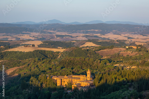 Obraz na płótnie Sunrise view of the Abbey of Monte Oliveto Maggiore, a large Benedictine monastery in Tuscany, Italy w salonie