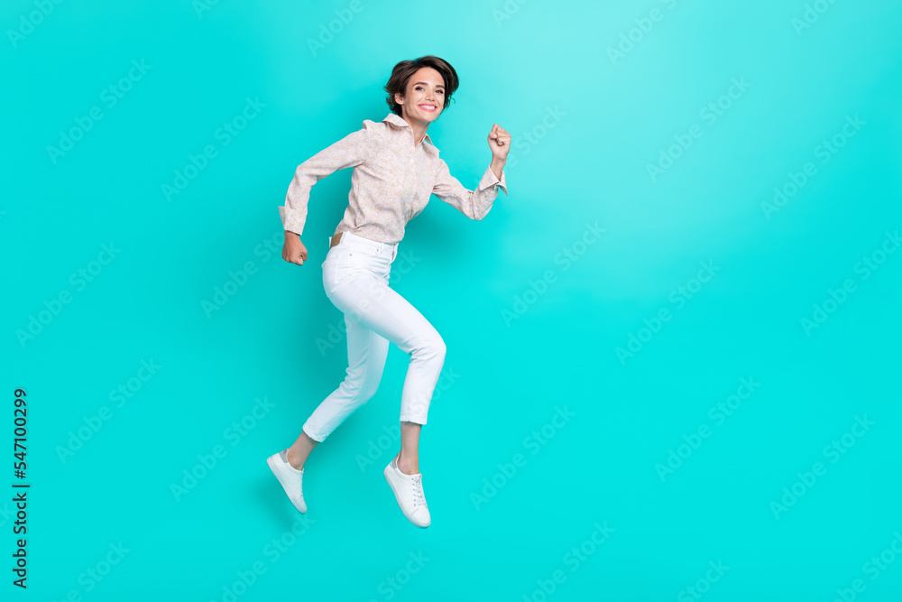 Full size photo of cheerful positive lady go harry black friday big sale empty space isolated on aquamarine color background Full size photo of cheerful positive lady go harry black friday big sale empty space isolated on aquamarine color background
