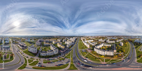 aerial full seamless spherical hdri 360 panorama view above road junction with traffic in residential complex with high-rise buildings in equirectangular projection.