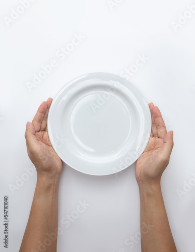 Male hands are holding a plate on a white isolated background