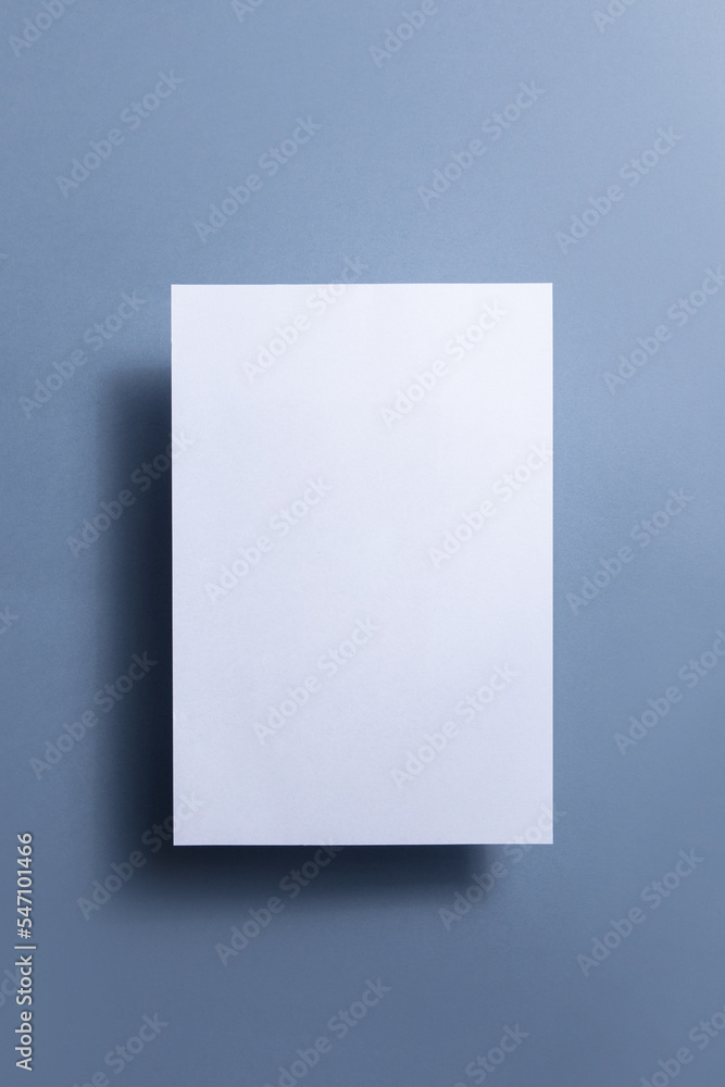 White blank paper page with shadow isolated on color background White blank paper page with shadow isolated on color background