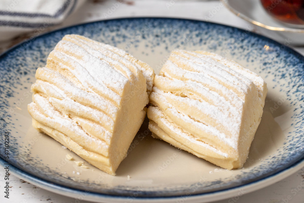 Flour cookies on a white wooden background. Mediterranean cuisine delicacies. Bakery desserts. close up Flour cookies on a white wooden background. Mediterranean cuisine delicacies. Bakery desserts. close up