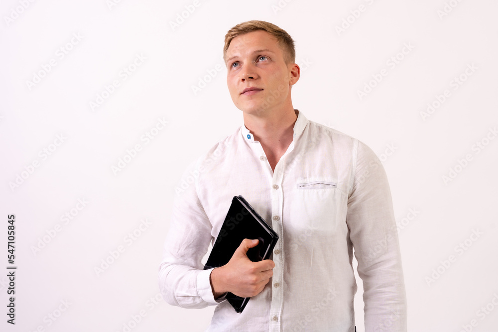 Portrait of a caucasian businessman man with a tablet working on a white background Portrait of a caucasian businessman man with a tablet working on a white background